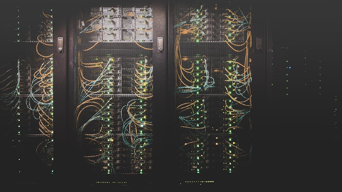 Server room with network cables and green indicator lights representing WordPress hosting infrastructure